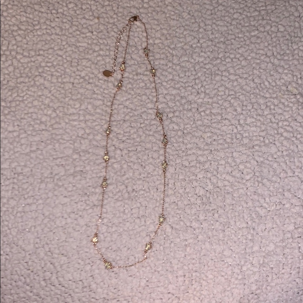 Gold necklace with pale green crystal stones